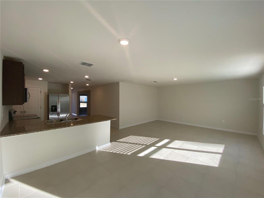 308 Hickory Course Radiel Ocala, FL 34472 - Photo 3 of 24 a view of a kitchen with a sink and a large window