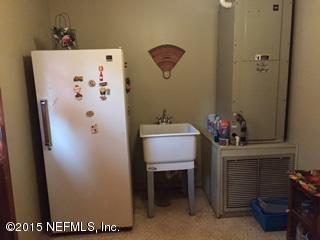 8236 Brooks Road Bryceville, FL 32009 - Photo 22 of 26 a white refrigerator freezer sitting inside of a kitchen