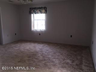 8236 Brooks Road Bryceville, FL 32009 - Photo 9 of 26 an empty room with a window
