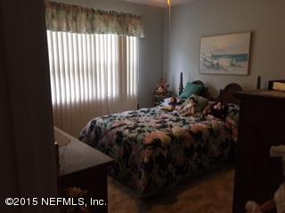 8236 Brooks Road Bryceville, FL 32009 - Photo 10 of 26 a bed sitting in a bedroom next to a window
