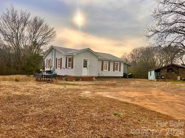 a bedroom with a bed and a desk