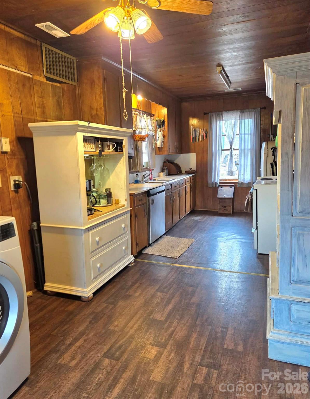 8772 Honeycutt Road Stanfield, NC 28163 - Photo 4 of 7 a kitchen with granite countertop a refrigerator and wooden floor