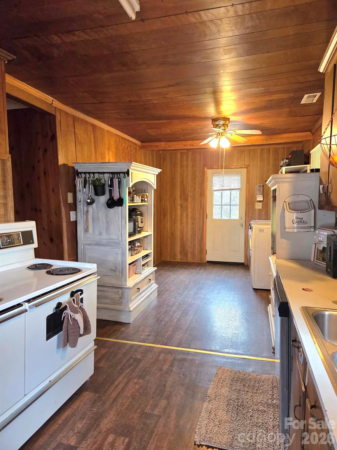 8772 Honeycutt Road Stanfield, NC 28163 - Photo 5 of 7 a kitchen with wooden floors and appliances