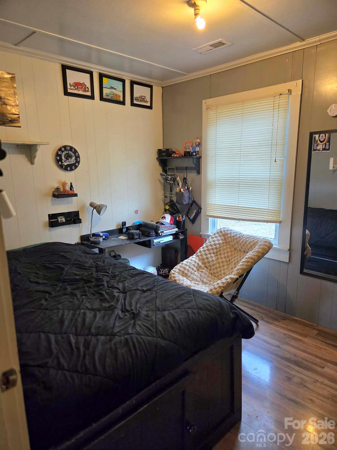 8772 Honeycutt Road Stanfield, NC 28163 - Photo 6 of 7 a living room with furniture and a flat screen tv