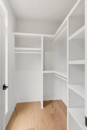 a view of an empty walk in closet