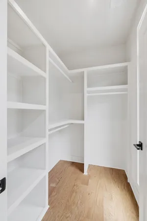 a view of an empty walk in closet