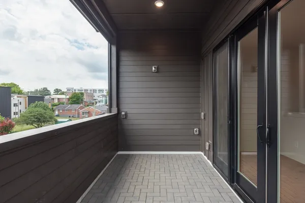 a view of a balcony from a hallway