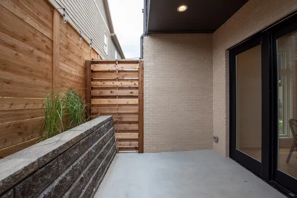 a view of room with stairs and wooden floor