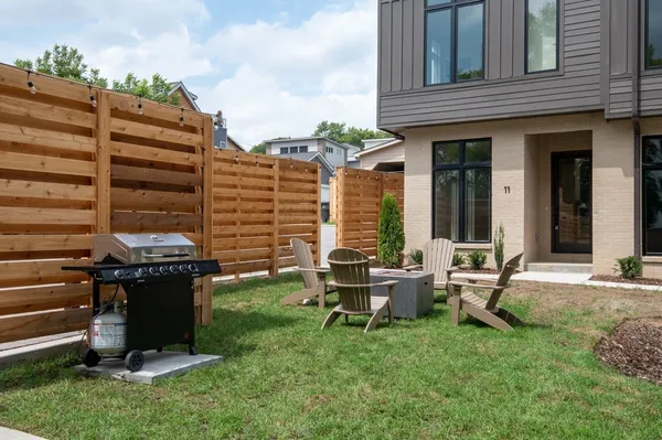 a view of a patio with table and chairs and potted plants