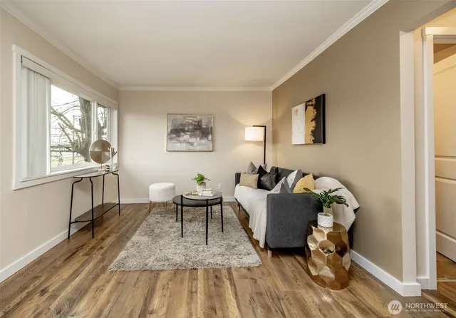 a living room with furniture and a window