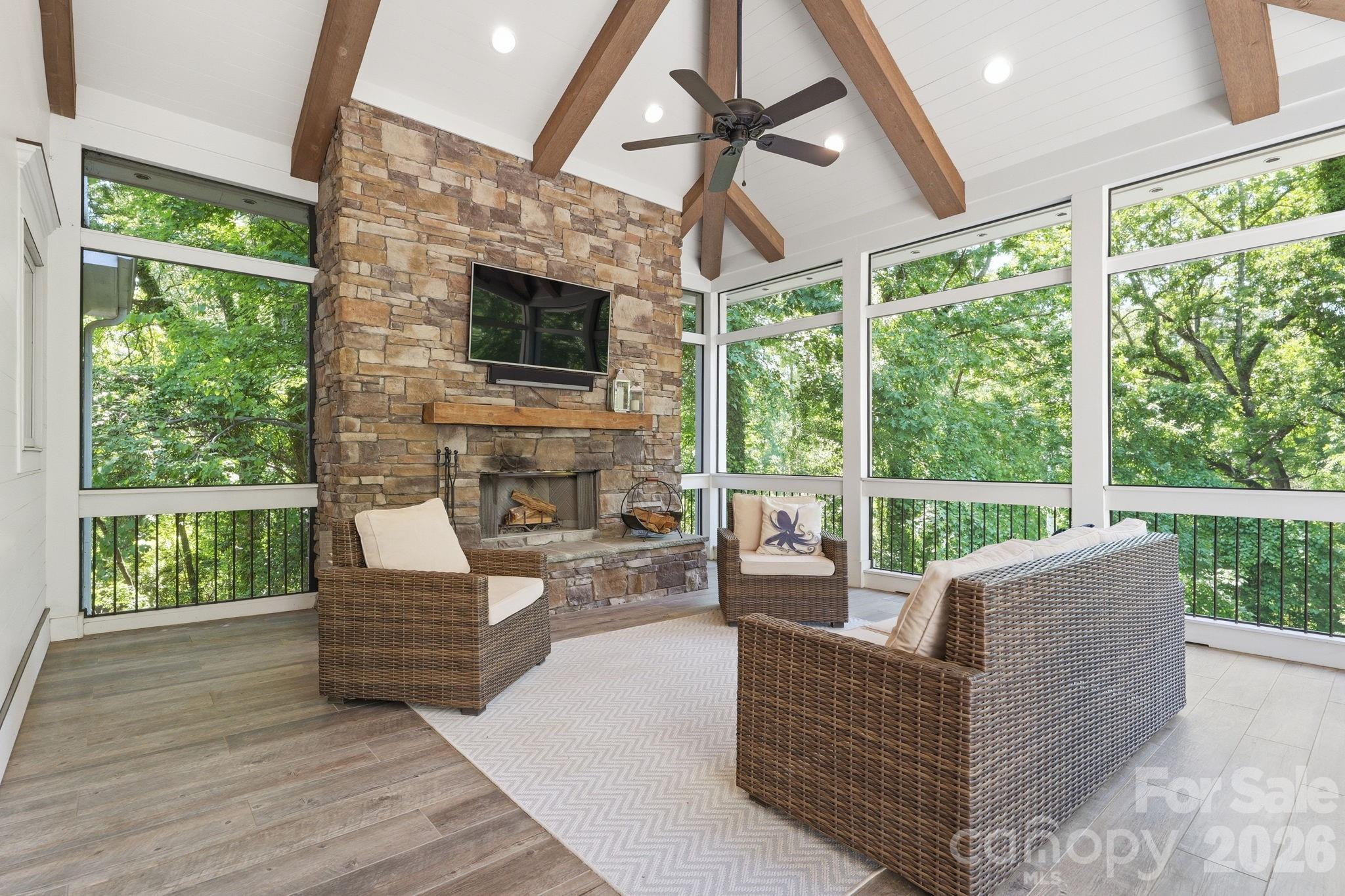 235 Grey Road Davidson, NC 28036 - Photo 13 of 42 a living room with patio furniture and a floor to ceiling window