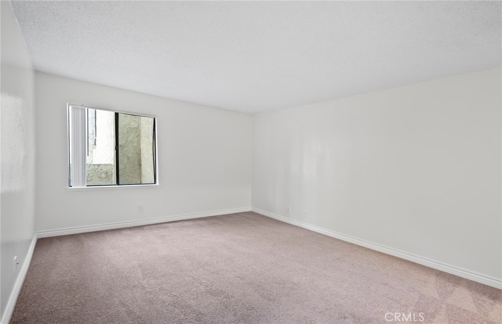 600 West 3rd Street, Unit 107 Santa Ana, CA 92701 - Photo 12 of 26 an empty room with a window