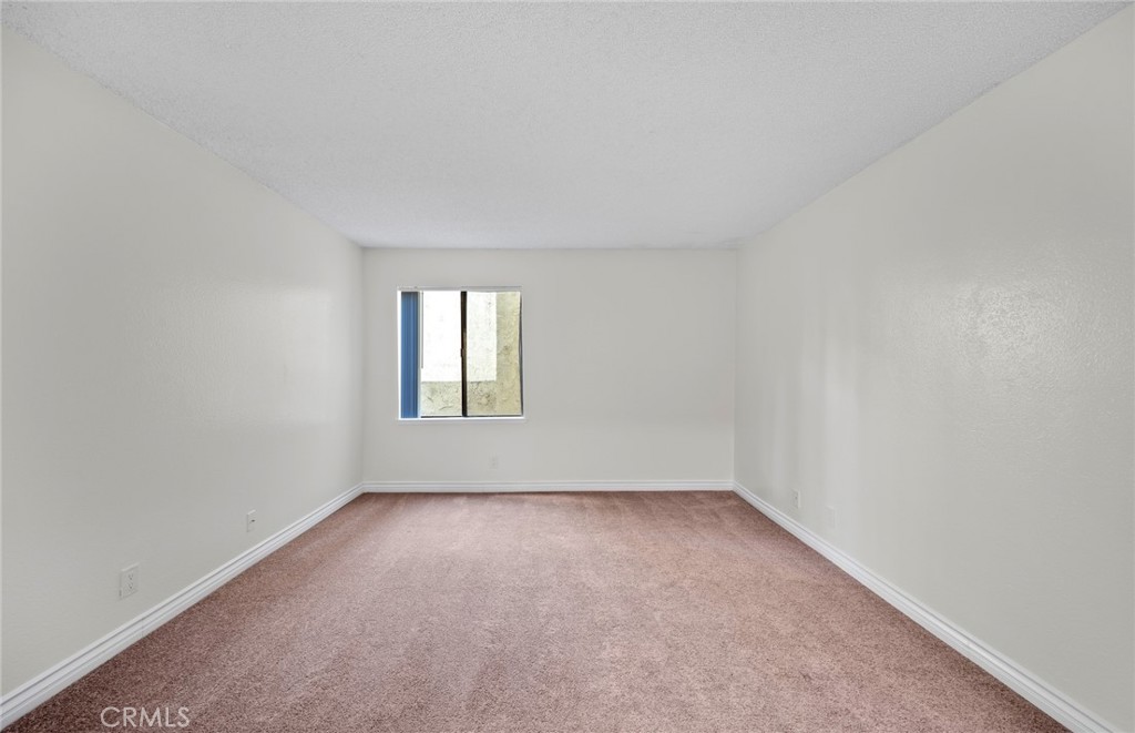 600 West 3rd Street, Unit 107 Santa Ana, CA 92701 - Photo 13 of 26 a view of an empty room with a window