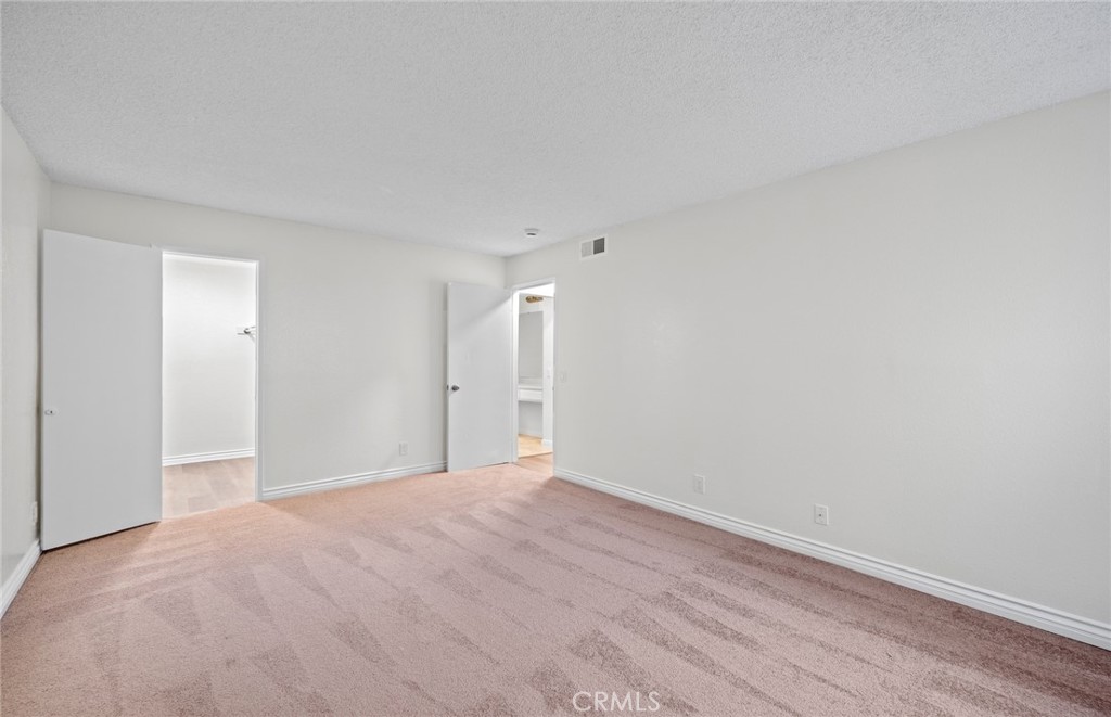 600 West 3rd Street, Unit 107 Santa Ana, CA 92701 - Photo 14 of 26 a view of an empty room with wooden floor