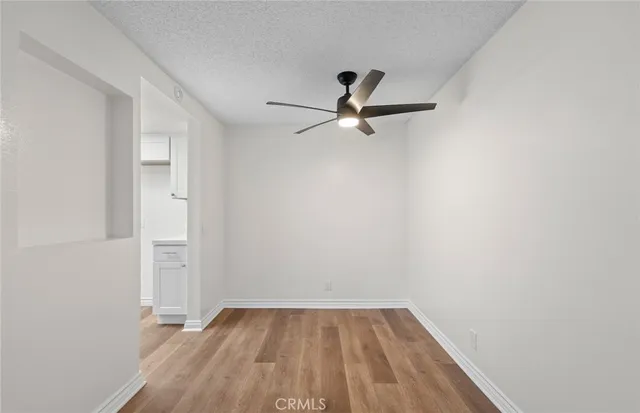 a view of a ceiling fan with wooden floor