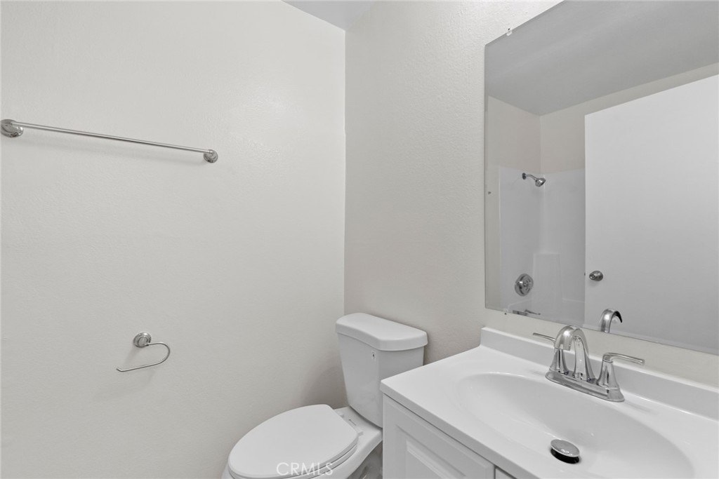 600 West 3rd Street, Unit 107 Santa Ana, CA 92701 - Photo 7 of 26 a bathroom with a sink and a toilet