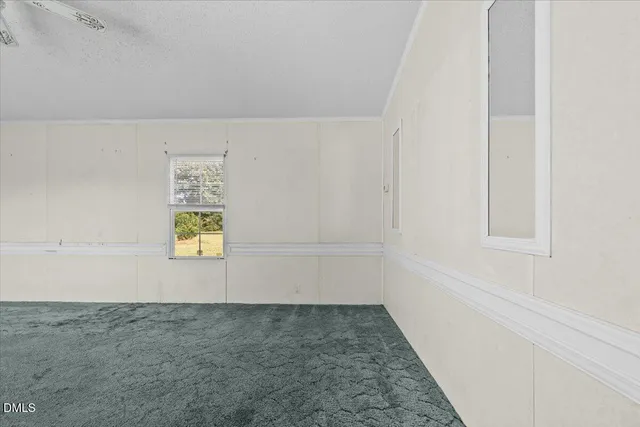 a view of storage and utility room with a window