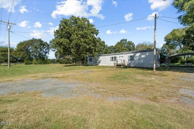 a view of a house with a big yard