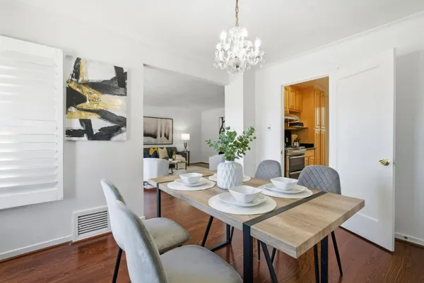 a view of a dining room with furniture and wooden floor