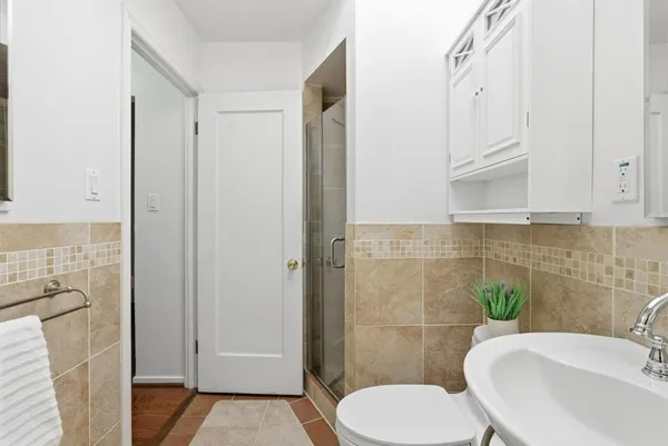 a bathroom with a toilet and a sink