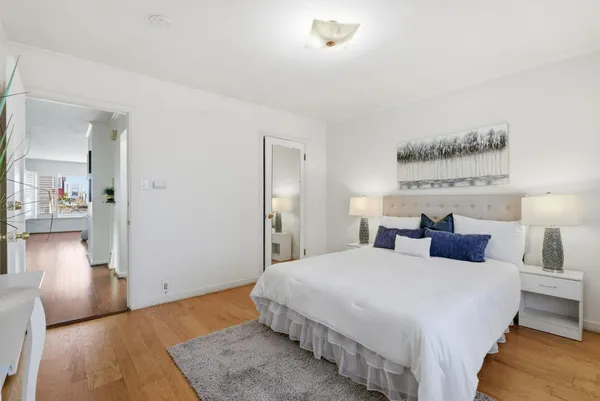 a bedroom with a bed and a view of bedroom