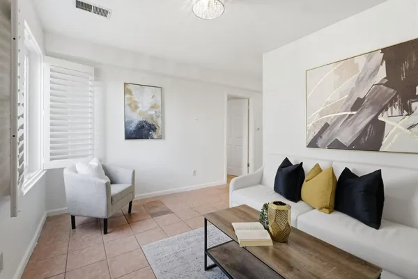 a living room with furniture and a window