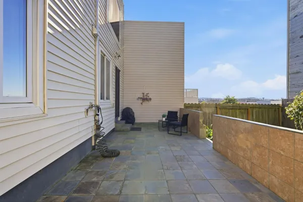 a view of a terrace with sitting area