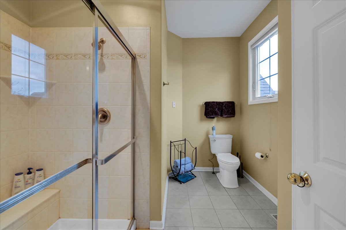 771 Wild Ginger Road Sugar Grove, IL 60554 - Photo 14 of 38 a bathroom with a toilet sink and shower