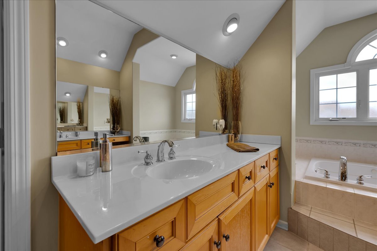 771 Wild Ginger Road Sugar Grove, IL 60554 - Photo 16 of 38 a bathroom with a sink double vanity and a mirror