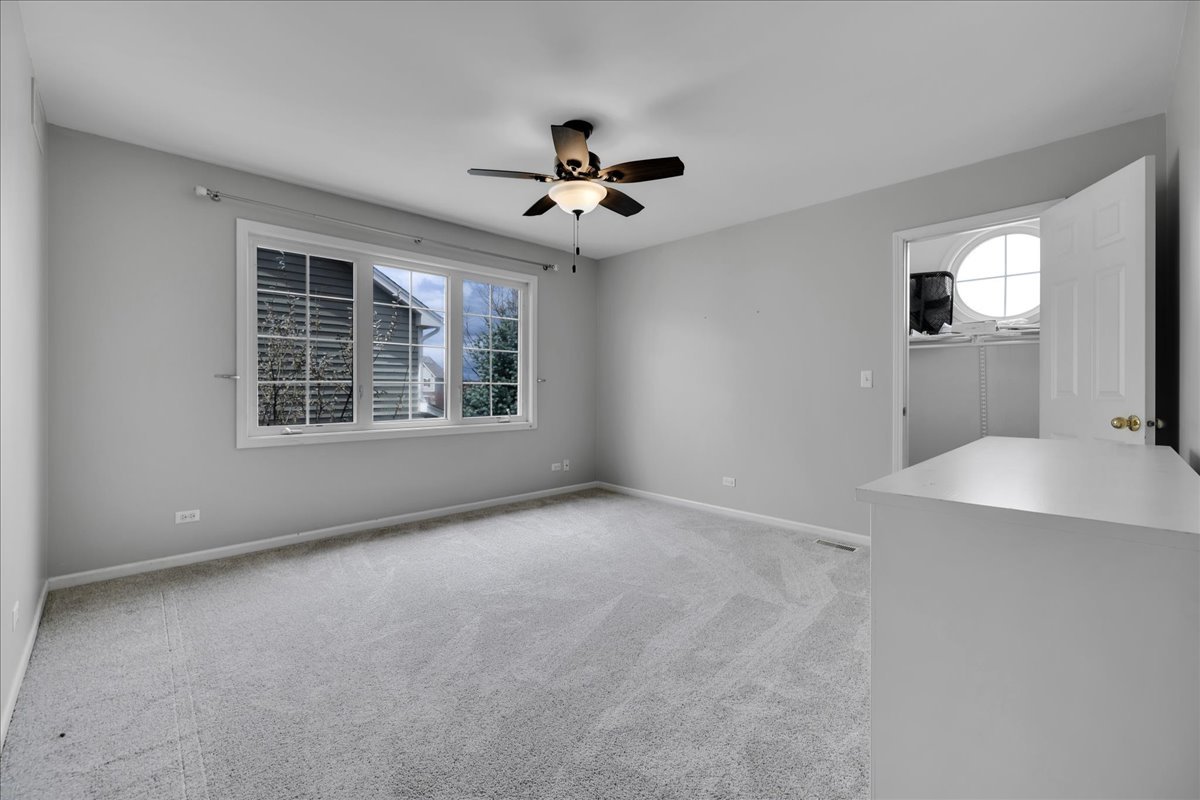771 Wild Ginger Road Sugar Grove, IL 60554 - Photo 28 of 38 an empty room with windows and fan