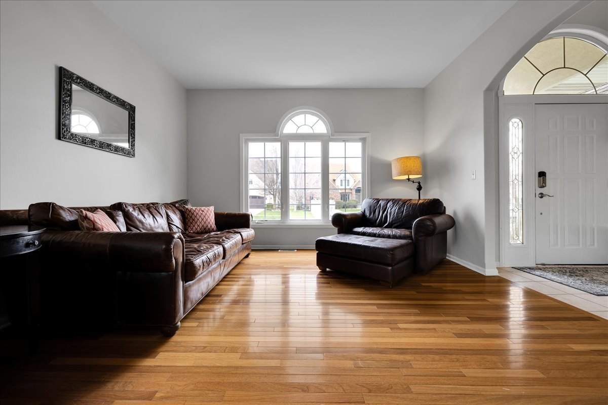 771 Wild Ginger Road Sugar Grove, IL 60554 - Photo 4 of 38 a living room with furniture and a large window