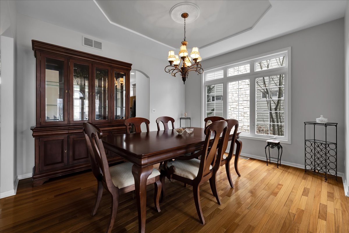 771 Wild Ginger Road Sugar Grove, IL 60554 - Photo 5 of 38 a view of a dining room with furniture window and wooden floor