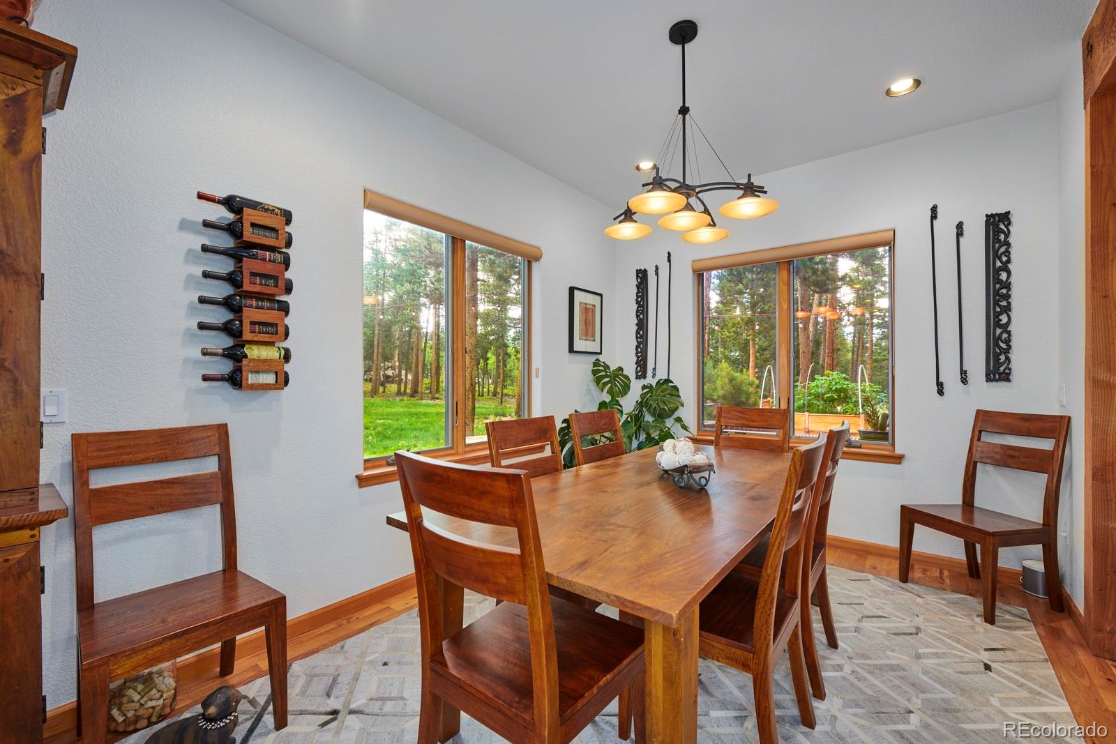 3589 Ridge Road Nederland, CO 80466 - Photo 15 of 40 a view of a dining room with furniture window and outside view