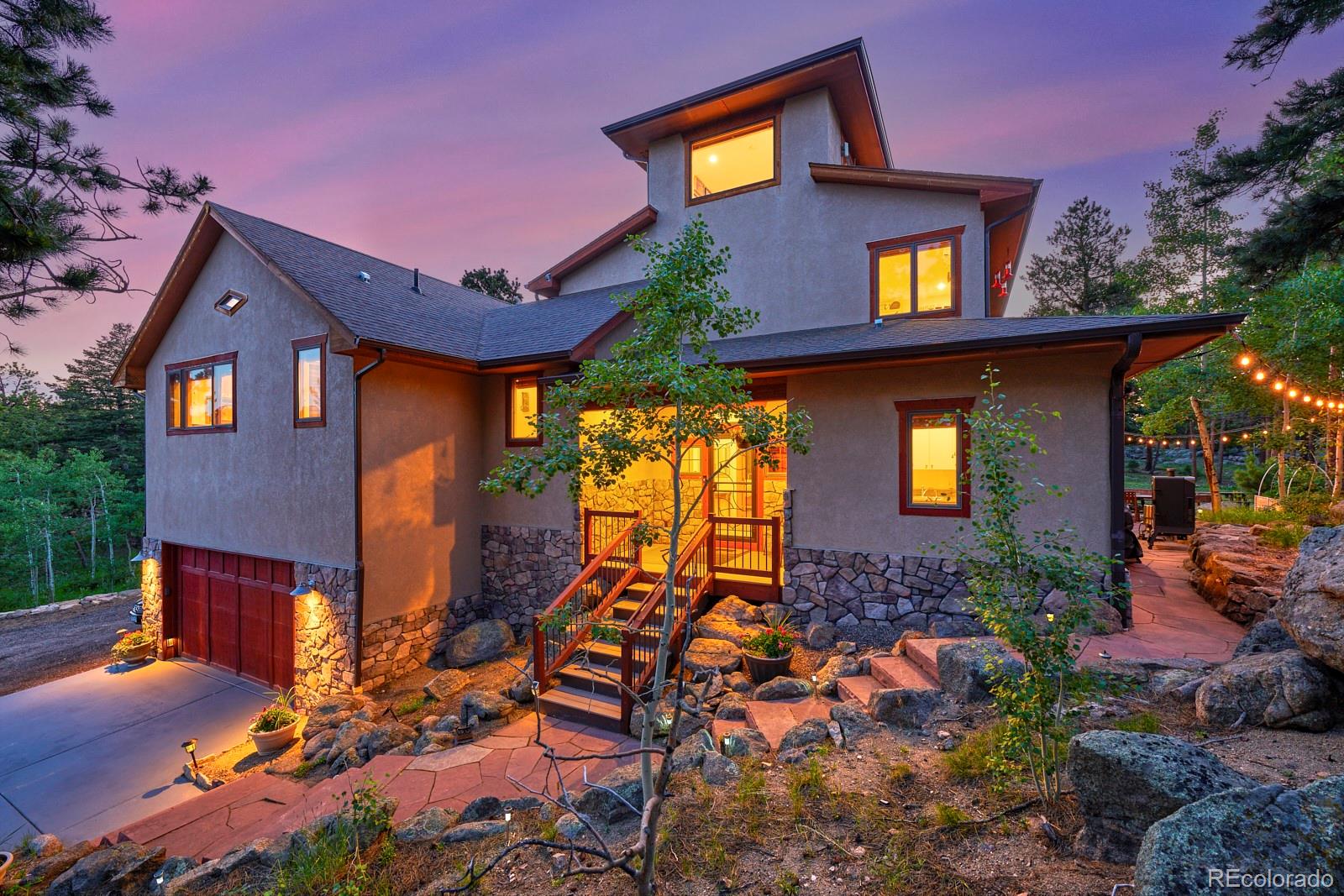3589 Ridge Road Nederland, CO 80466 - Photo 2 of 40 a front view of a house with a yard