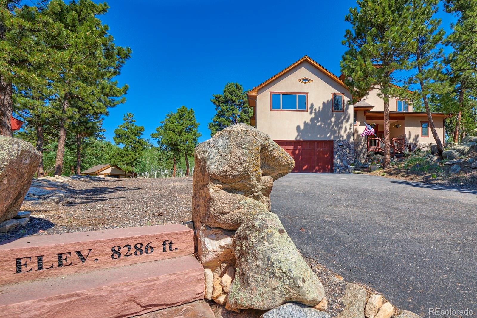 3589 Ridge Road Nederland, CO 80466 - Photo 3 of 40 a front view of a house with a yard