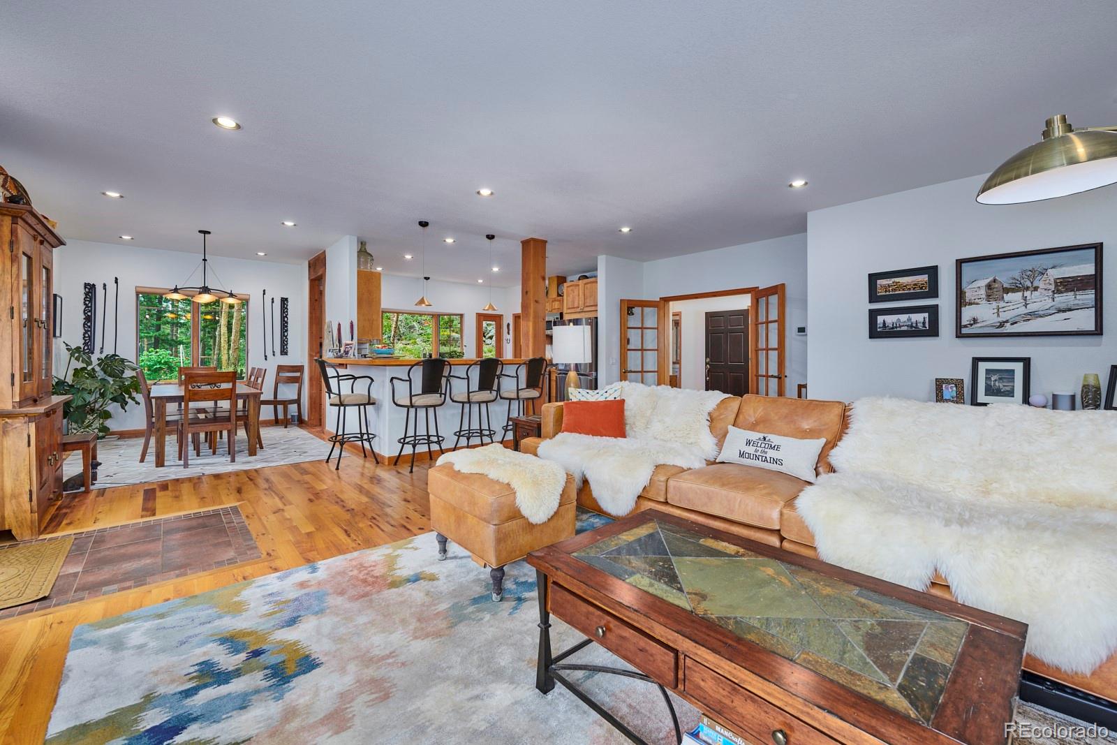 3589 Ridge Road Nederland, CO 80466 - Photo 7 of 40 a living room with furniture kitchen view and a dining table