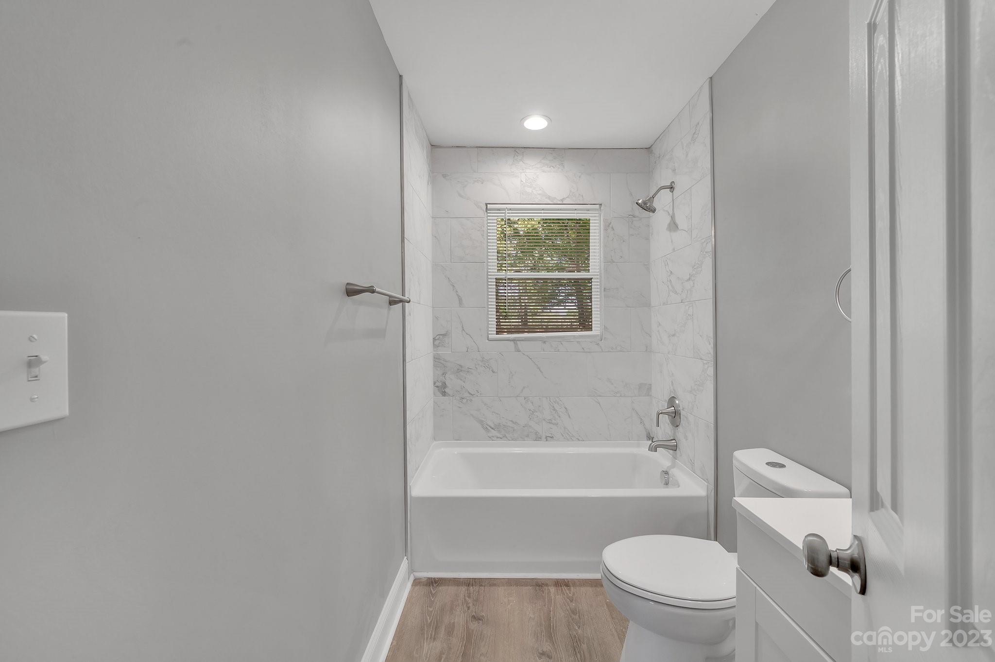 128 Jeter Street Chester, SC 29706 - Photo 13 of 20 a bathroom with a toilet and a bathtub