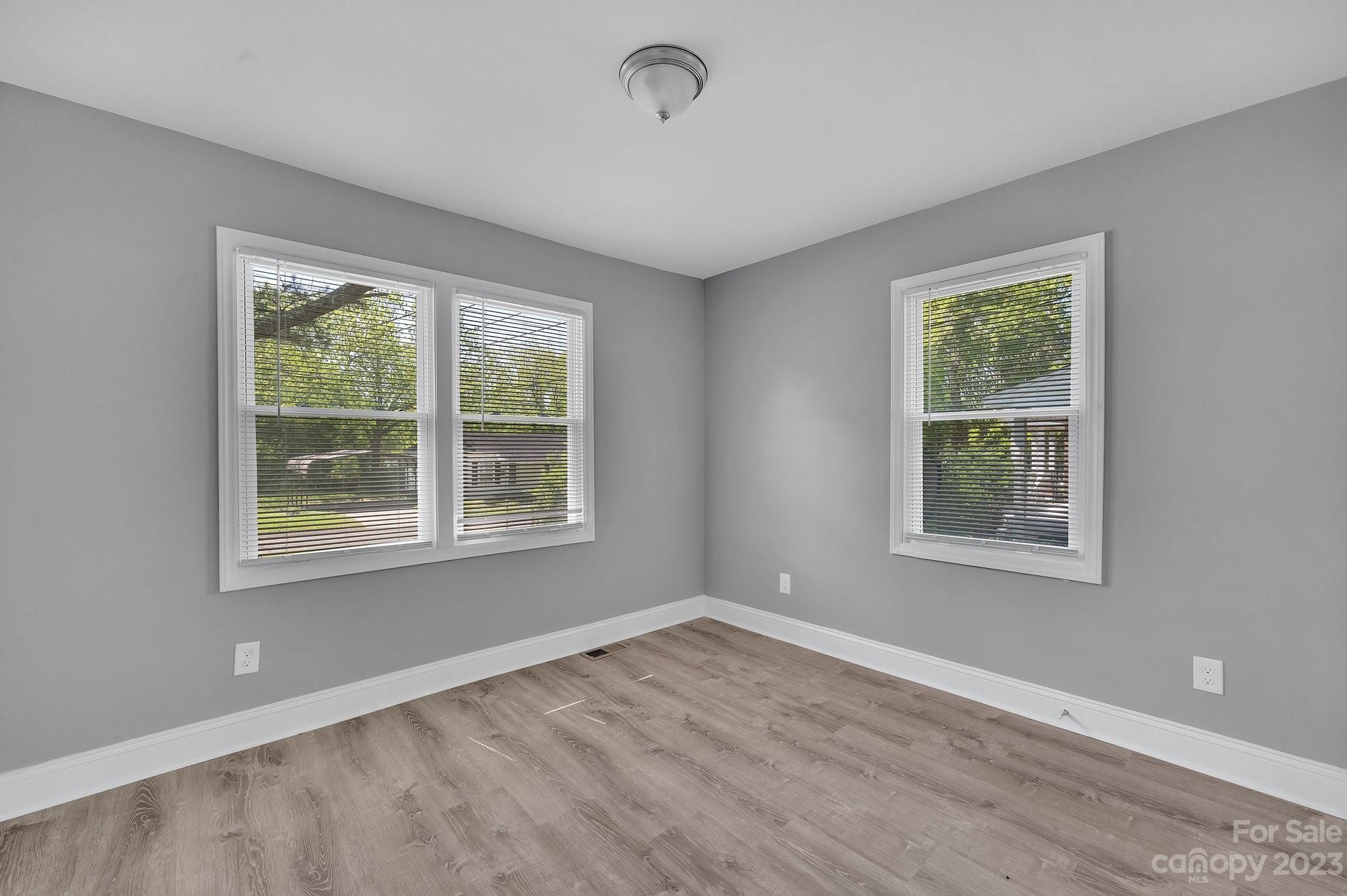 128 Jeter Street Chester, SC 29706 - Photo 17 of 20 a view of an empty room with wooden floor and a window