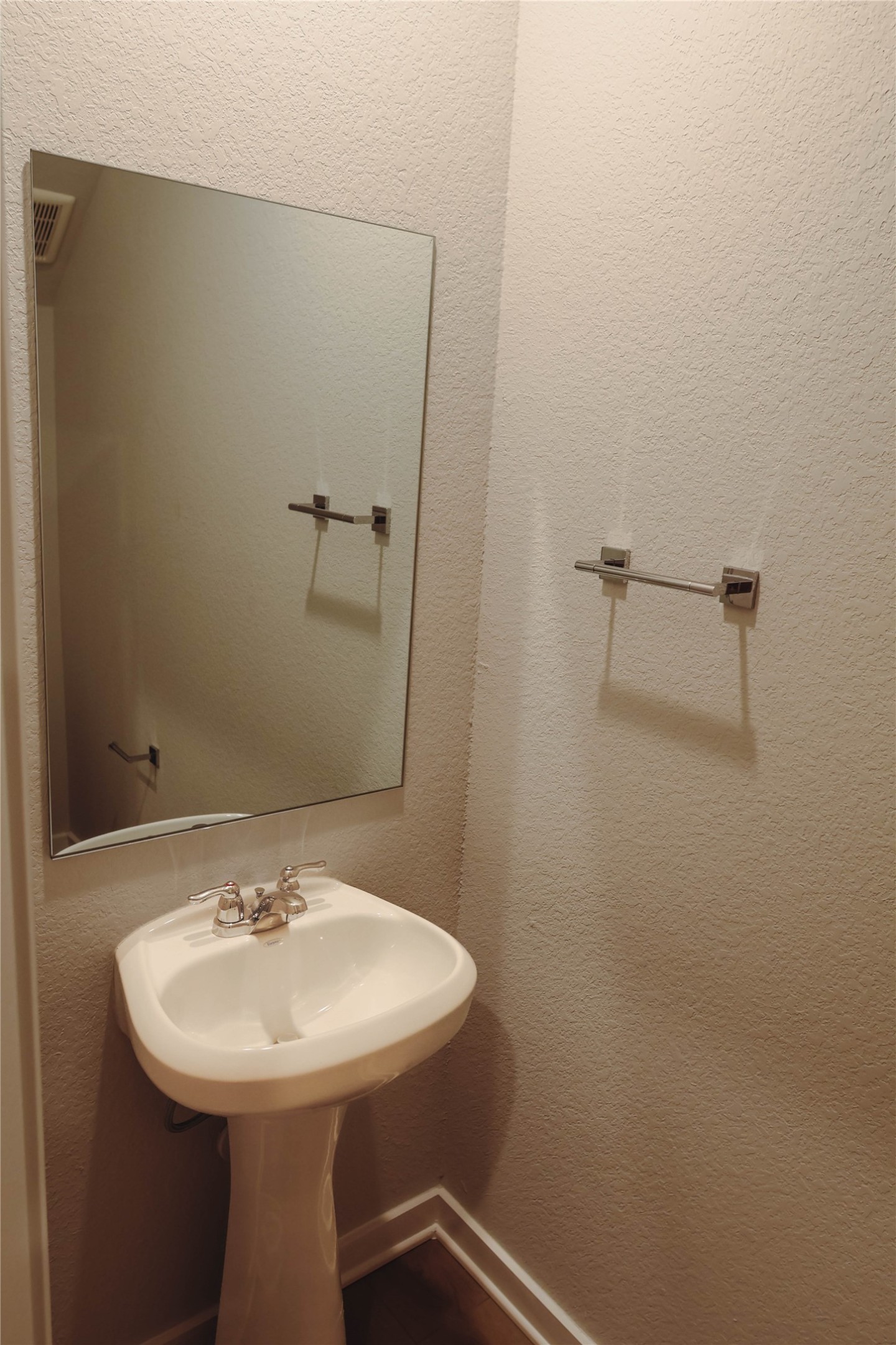 16 Courageous Way Magnolia, TX 77354 - Photo 5 of 19 a bathroom with a sink a toilet and mirror