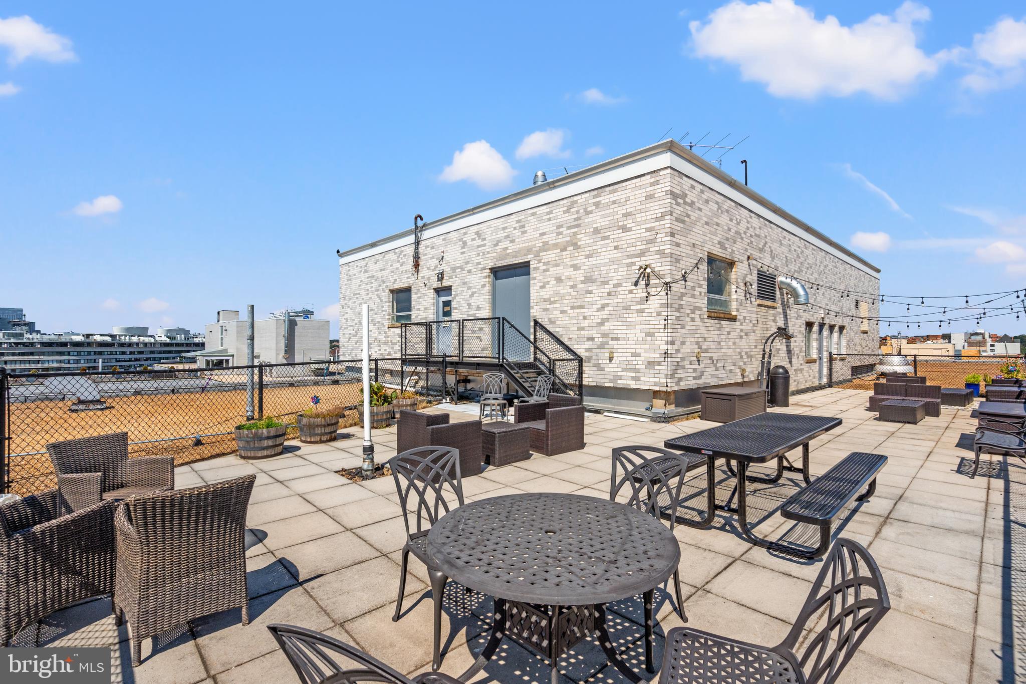 730 24th Street Northwest, Unit 503 Washington, DC 20037 - Photo 17 of 18 an outdoor space with patio furniture and ocean view