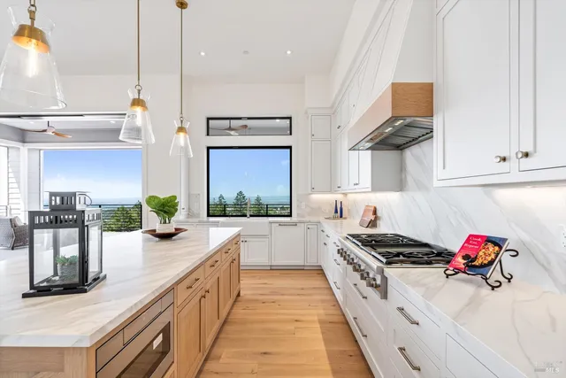 a kitchen with stove and cabinets
