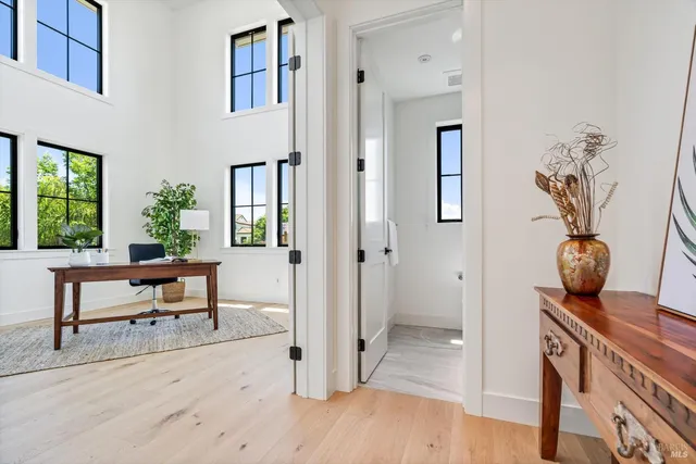 a view of a livingroom with furniture and wooden floor