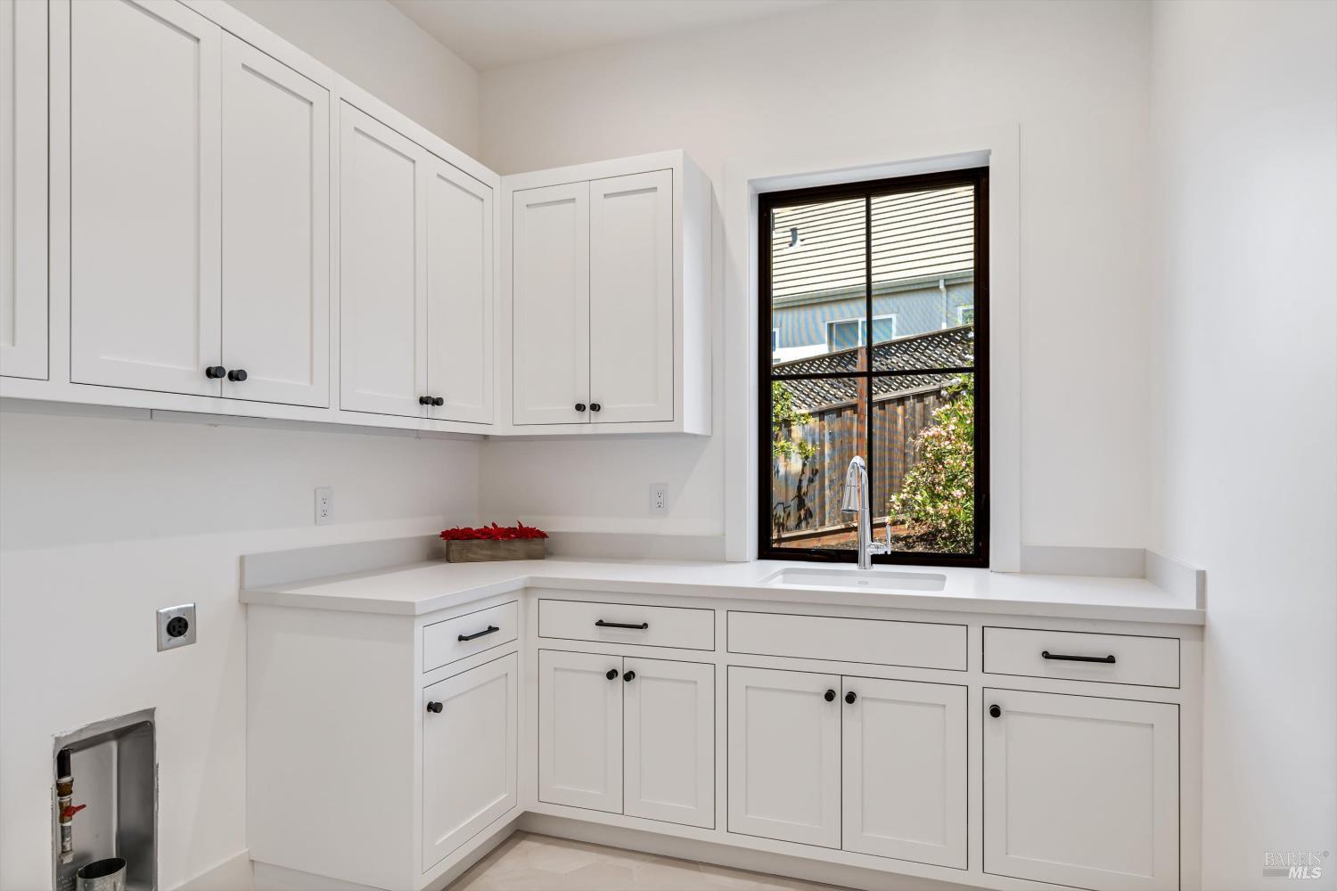 3855 Royal Manor Place Santa Rosa, CA 95404 - Photo 21 of 34 a kitchen with white cabinets and window