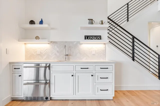 a kitchen with cabinets and a window