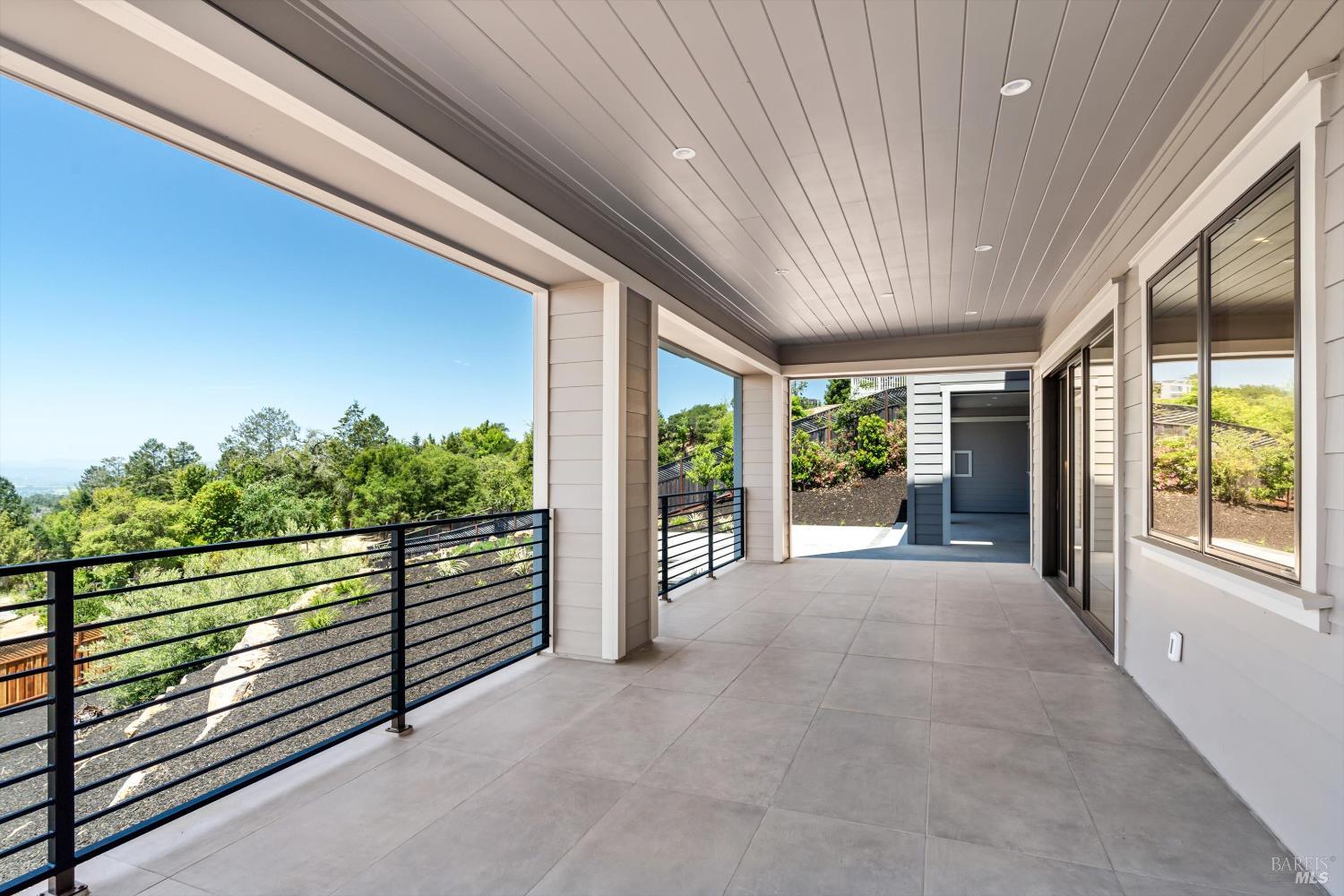 3855 Royal Manor Place Santa Rosa, CA 95404 - Photo 24 of 34 a view of a room with wooden floor and iron stairs