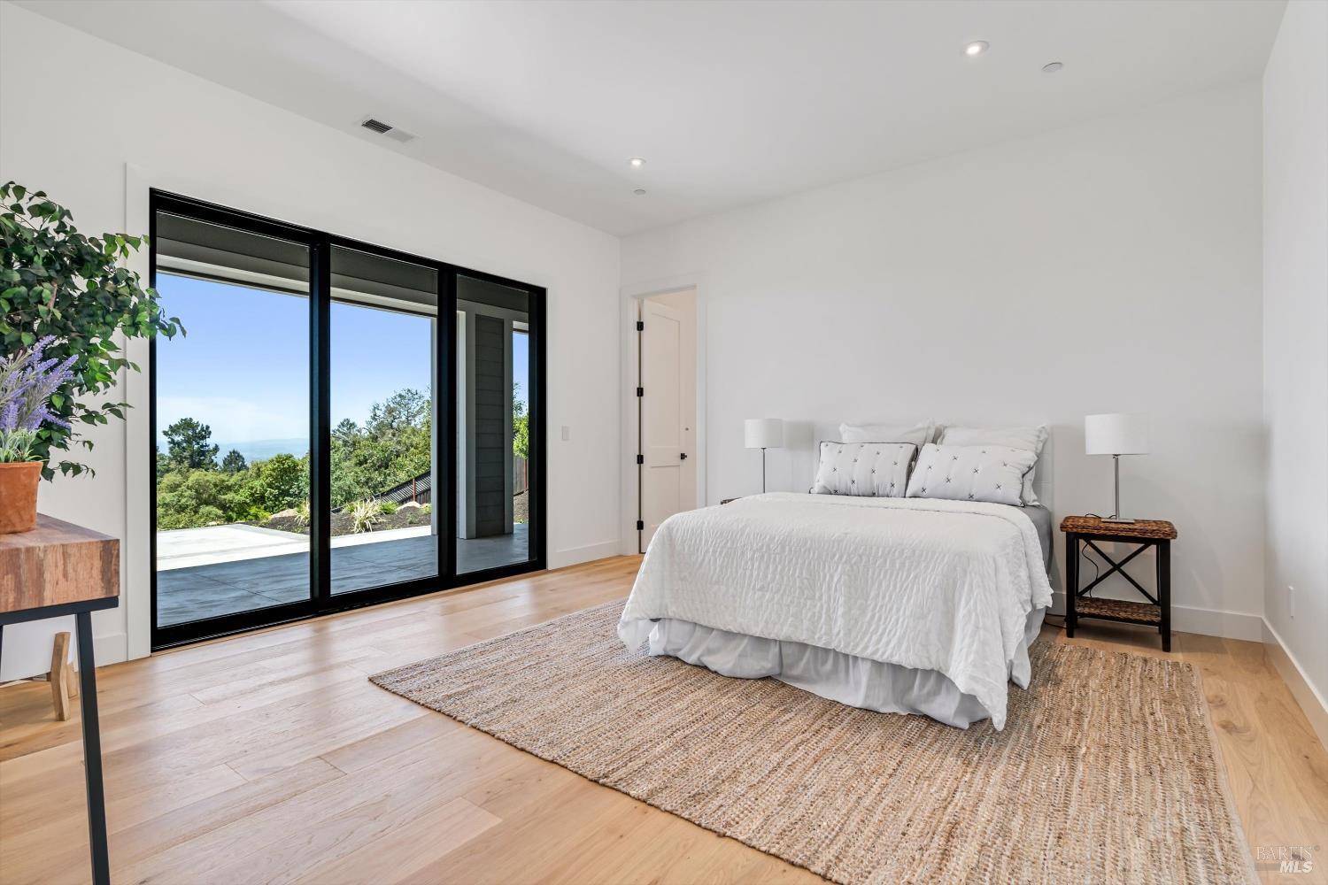3855 Royal Manor Place Santa Rosa, CA 95404 - Photo 27 of 34 a spacious bedroom with a bed and wooden floor