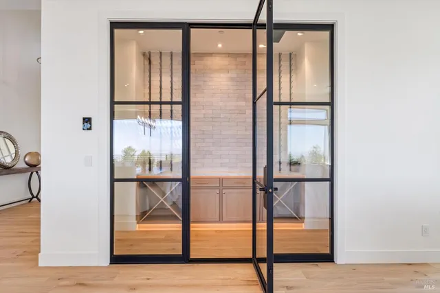 a view of staircase with a glass door and painted walls