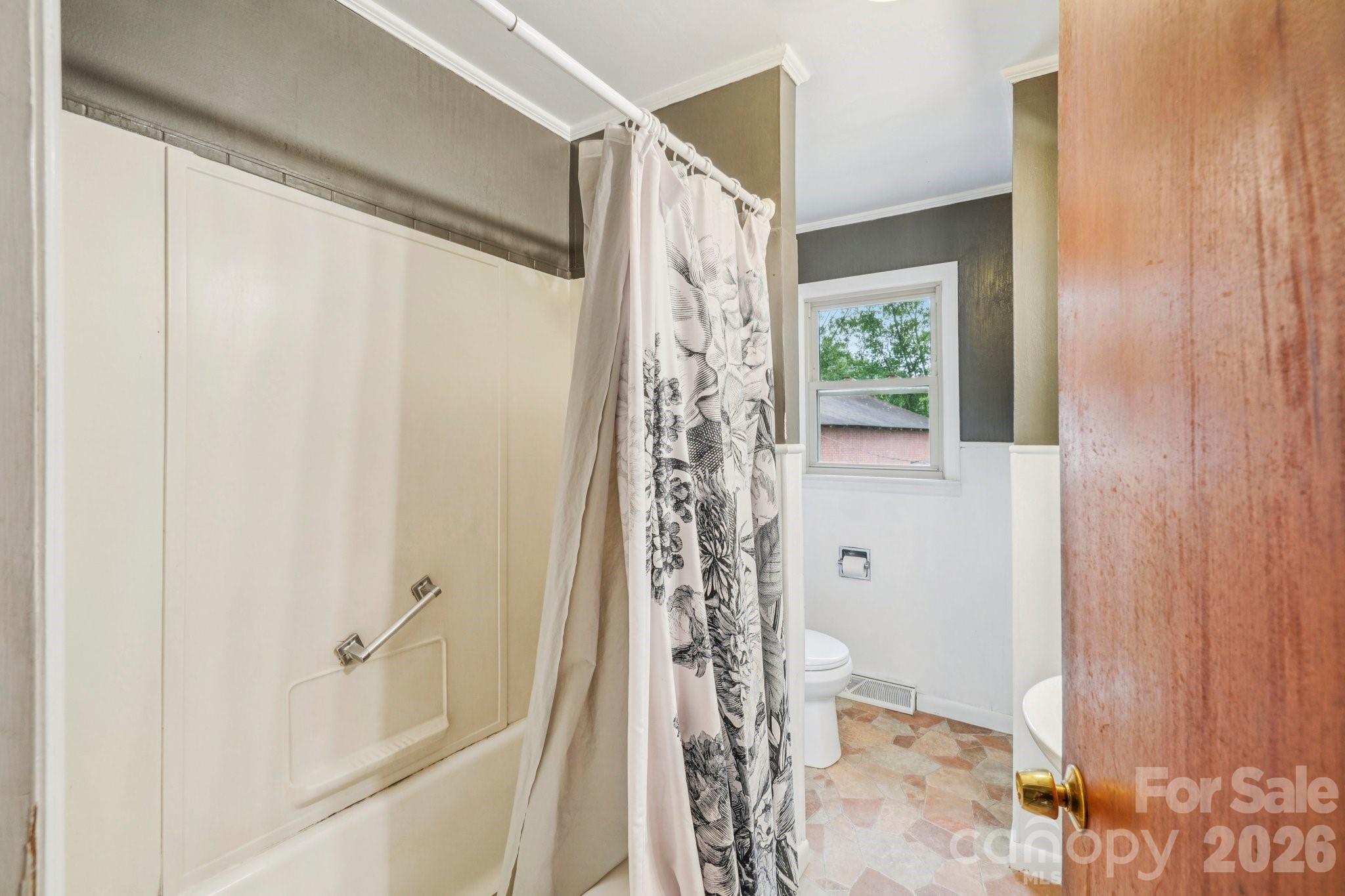 8061 Highway 70 Old Fort, NC 28762 - Photo 20 of 37 a bathroom with a shower curtain and a window
