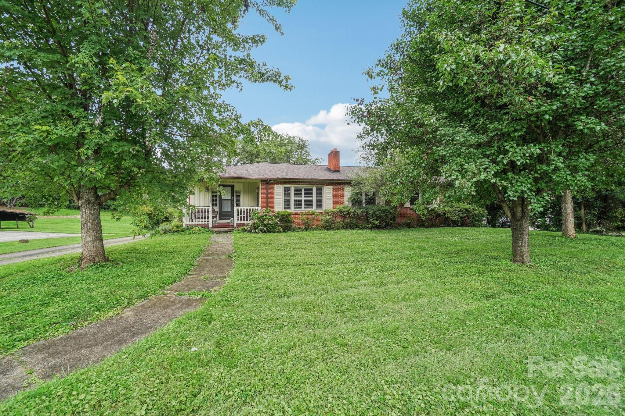 8061 Highway 70 Old Fort, NC 28762 - Photo 32 of 37 a view of house with a big yard and large trees