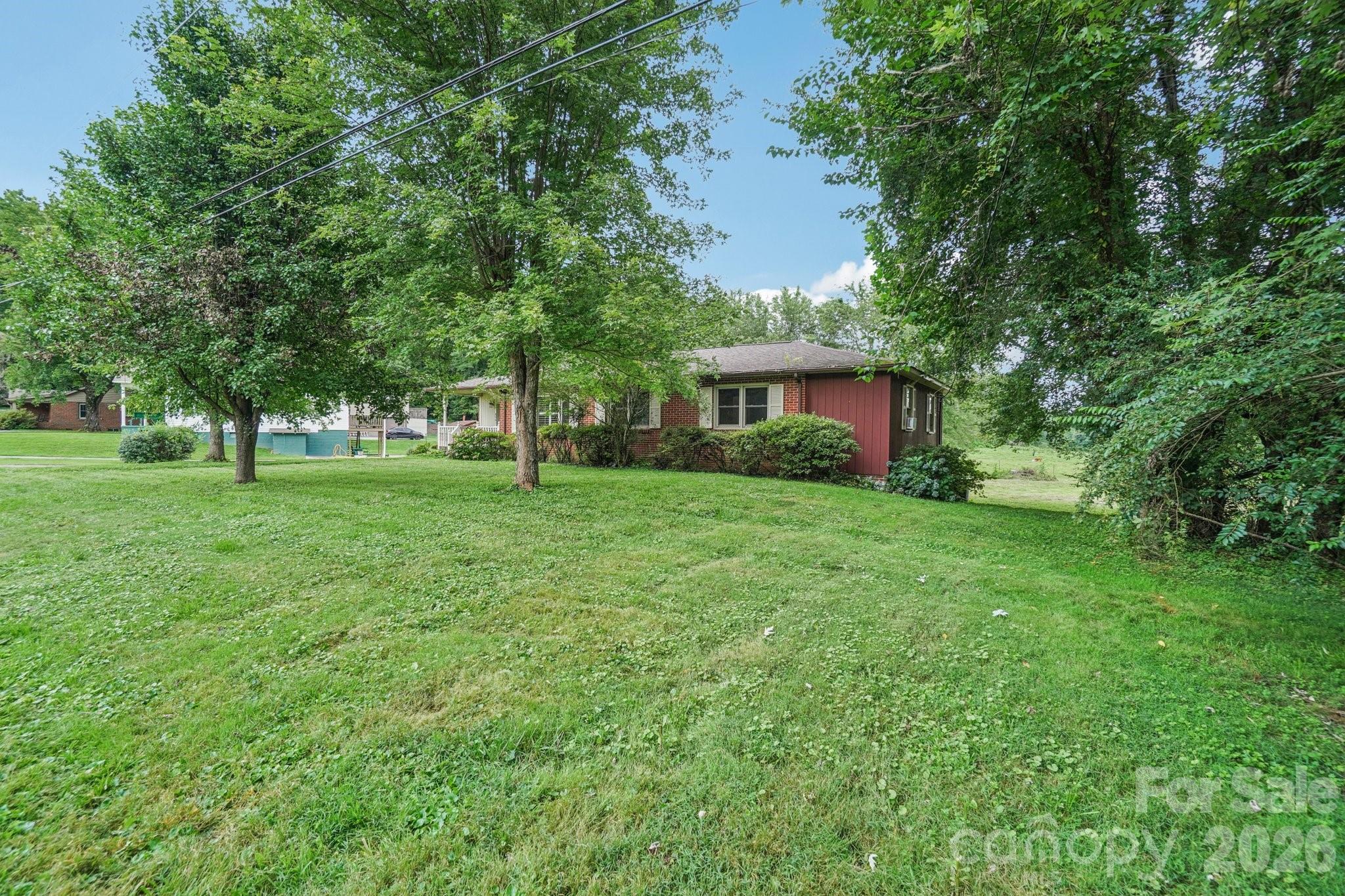 8061 Highway 70 Old Fort, NC 28762 - Photo 33 of 37 a view of house with yard and green space